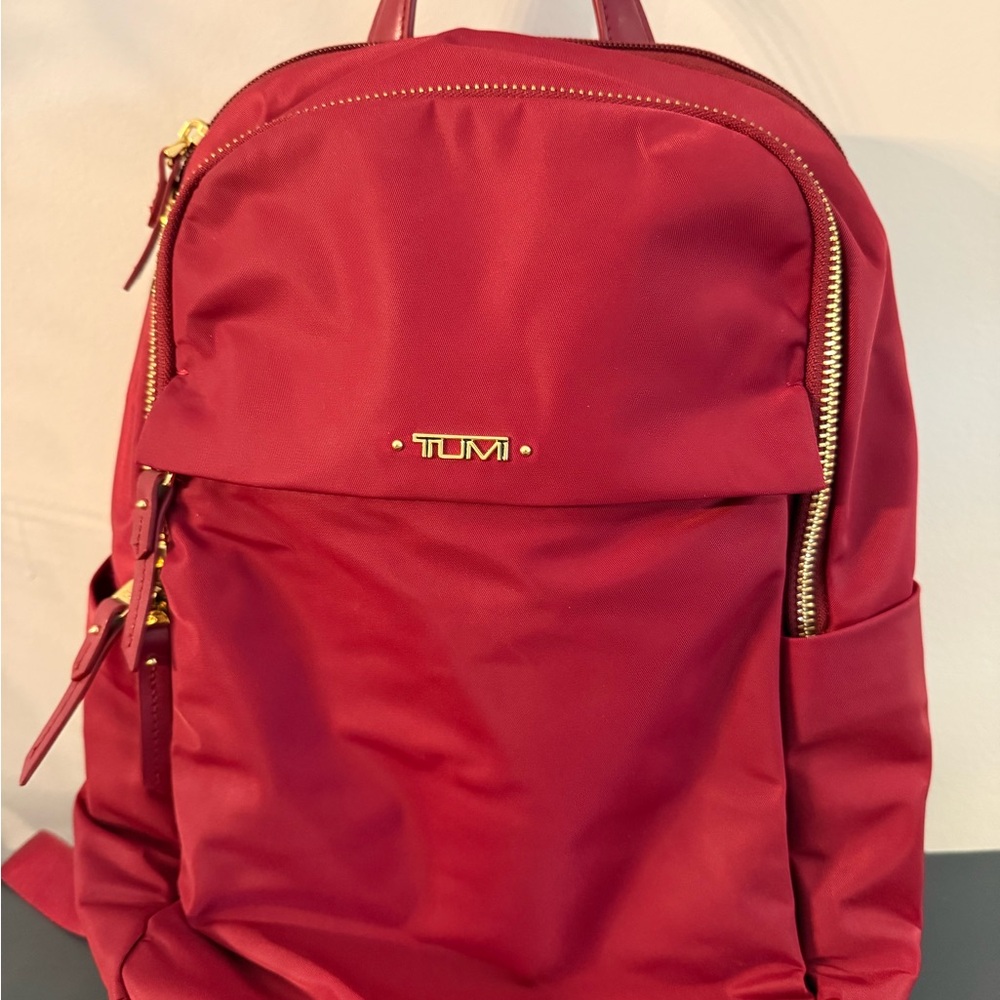 TUMI Burgundy Backpack with Gold Accents